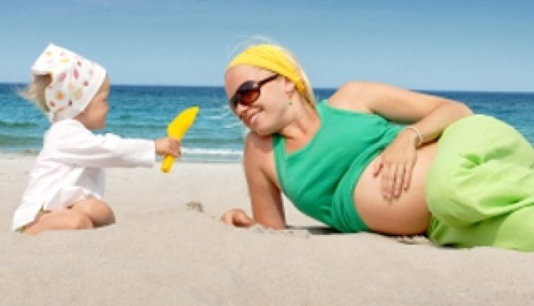Zwanger op het strand